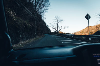 Road seen through car windshield