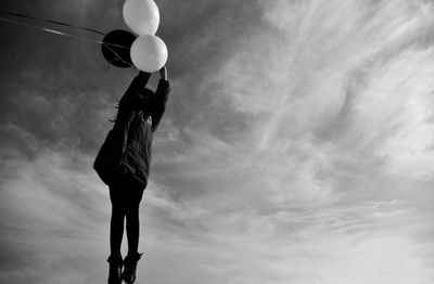 Low angle view of balloons against sky