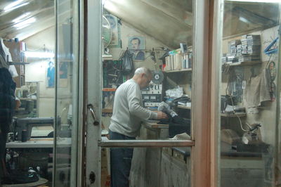 Man working on glass window