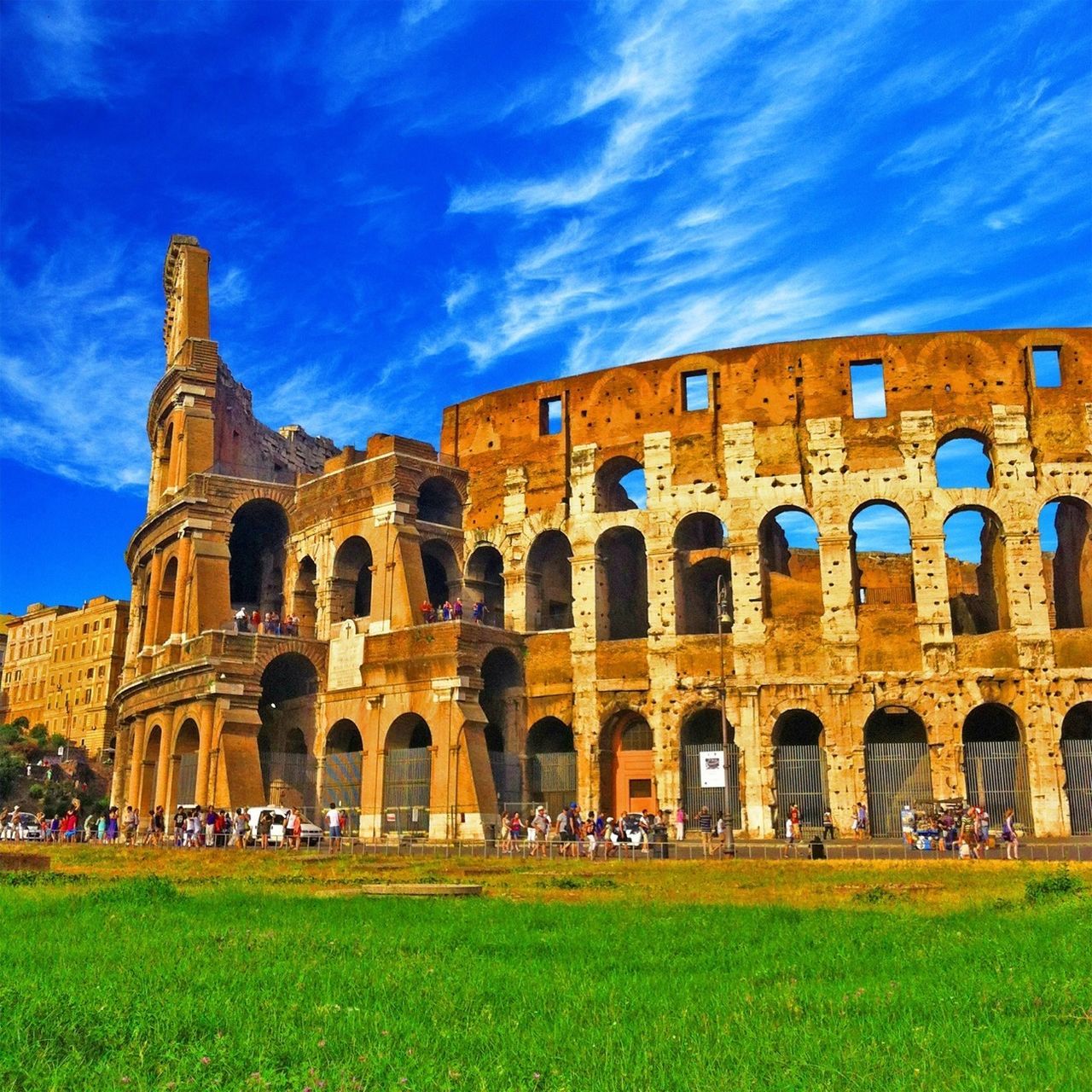 architecture, built structure, building exterior, history, grass, arch, sky, famous place, travel destinations, tourism, old ruin, old, travel, ancient, the past, culture, cloud - sky, international landmark, facade, tourist