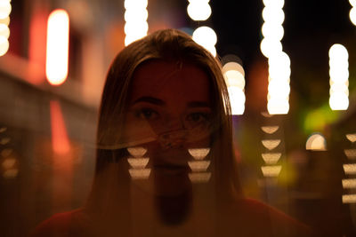 Double exposure of woman and lights