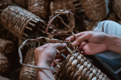 Midsection of man holding rope