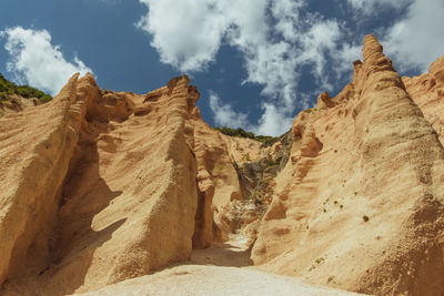 Panoramic view of arid landscape against sky