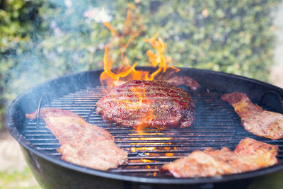 Close-up of meat cooking on barbecue grill