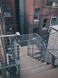 Staircase by buildings in city