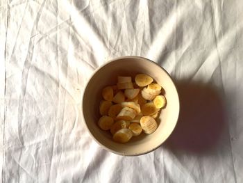 High angle view of food in bowl on bed