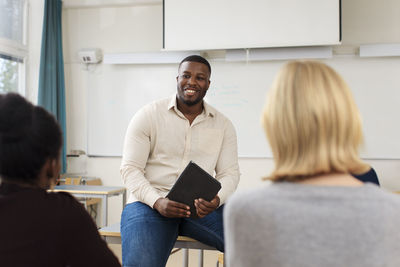 Teacher giving lecture in classroom