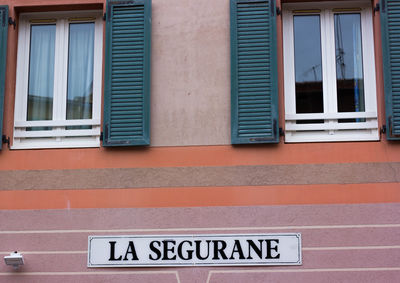 Information sign on wall of building