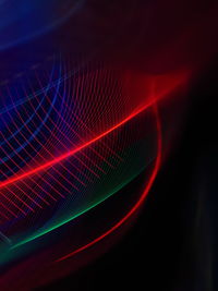 Close-up of light painting against abstract background