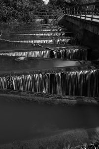 High angle view of water flowing in dam