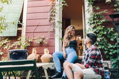 People sitting in front of building
