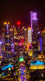 Illuminated city buildings at night