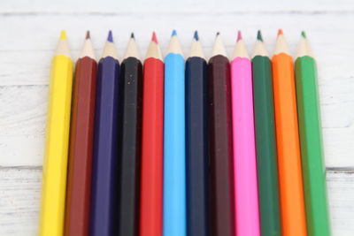 Close-up of colored pencils on white background