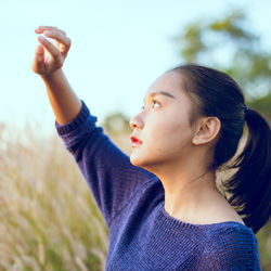 Portrait of young woman looking away