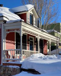 Snow covered buildings in city