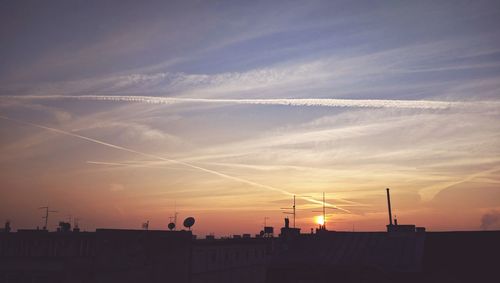 Silhouette built structure against sky during sunset