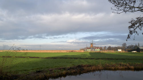 Built structure on field against sky