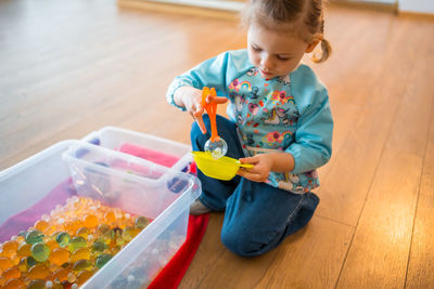 Boy playing with toys on table