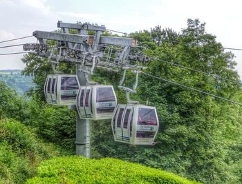 Overhead cable car against sky