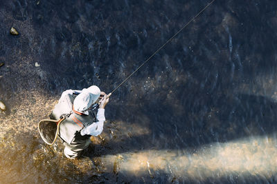 Man fishing in water