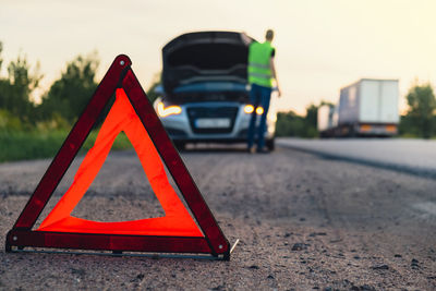 Close-up of car on road