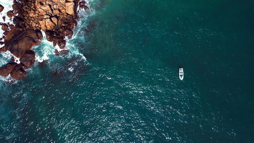 High angle view of rocks in sea