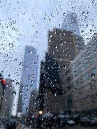 Full frame shot of wet glass window in rainy season