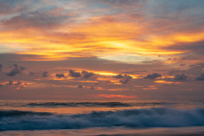 Low angle view of dramatic sky during sunset