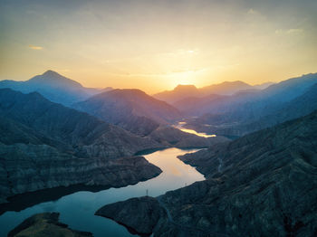 Scenic view of mountains against sky during sunset