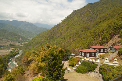 High angle view of buildings and mountains against sky