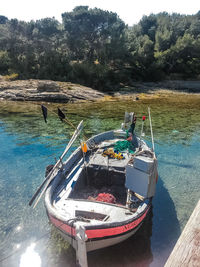 Boats moored on sea shore