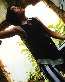 Close-up of woman standing on wall