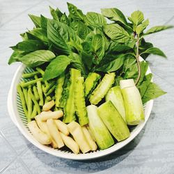 High angle view of chopped vegetables in bowl on table