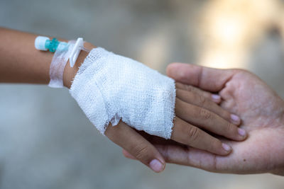 Close-up of hand with bandage
