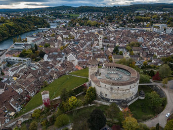 High angle view of town against cloudy sky