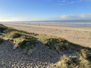 Scenic view of beach against sky