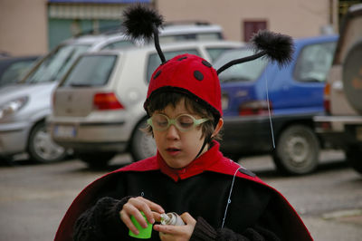 Portrait of boy wearing sunglasses in city