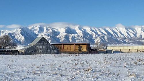 Scenic view of snow covered mountains against sky