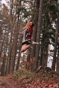 Woman in forest during autumn