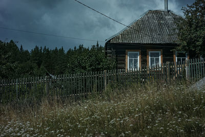 House on field against sky