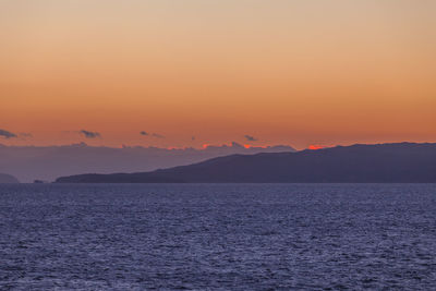 Clouds at sunset over the islands of the saronic gulf, greece