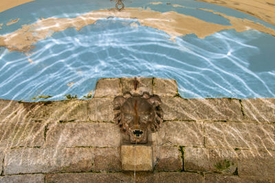 High angle view of sculpture by swimming pool
