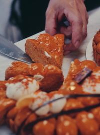 Slice of carrot vegan cake being cut