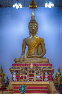 Statue against temple building