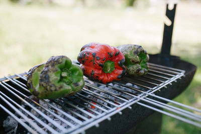 Close-up of bell peppers roasting on barbecue grill