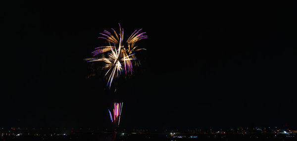 Firework display at night