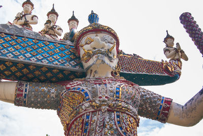 Low angle view of statue against sky