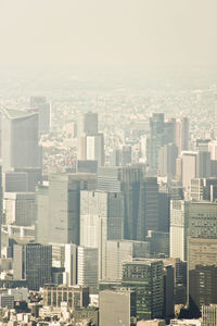 High angle view of buildings in city against sky