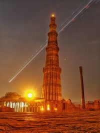 Silhouette of tower at night