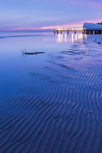 Scenic view of sea against sky at dusk